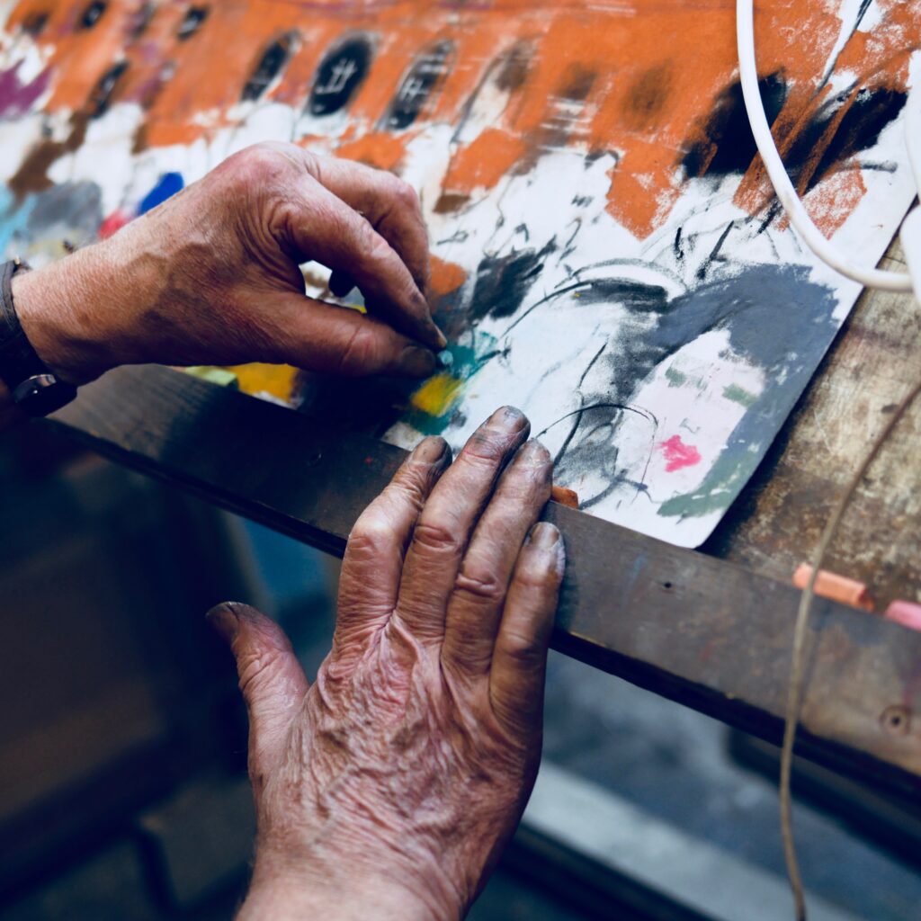 Close up of Peter Cameron's hands whilst drawing