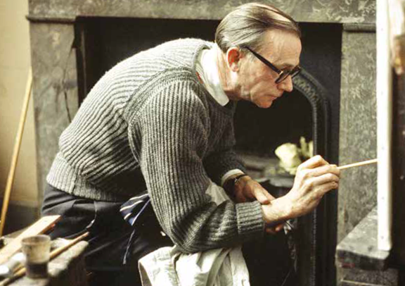 William Coldstream pictured painting in his studio