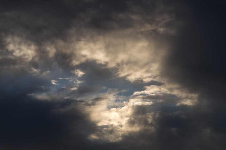 Image showing a grey cloudy sky with some light breaking through