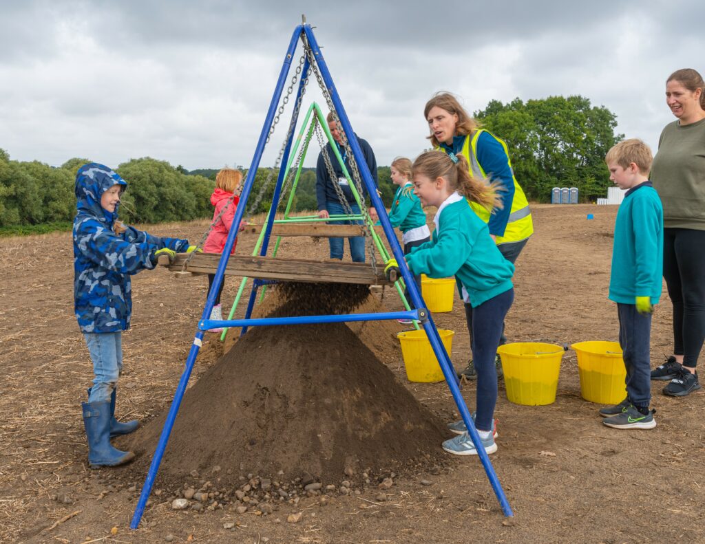 Volunteers from Rendlesham Primary School sieving excavated soil for finds.
