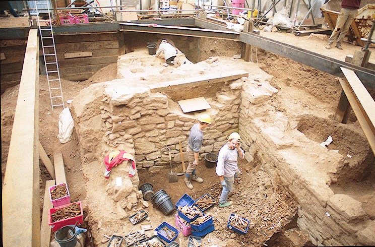 View of excavators working in the Saxon charnel pit which had a depth of nearly 5m 